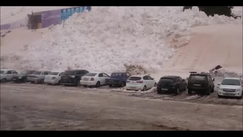 An avalanche hit a car parking lot