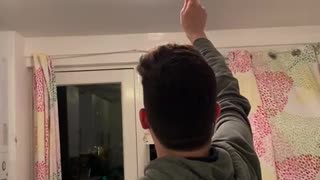 Guy Smashing Bug Breaks Kitchen Light Cover
