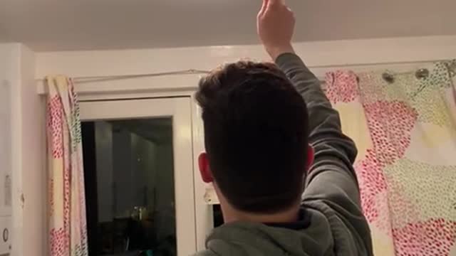 Guy Smashing Bug Breaks Kitchen Light Cover