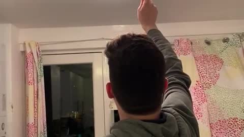 Guy Smashing Bug Breaks Kitchen Light Cover