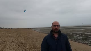 A beautiful kite. A kite surfer behind me .