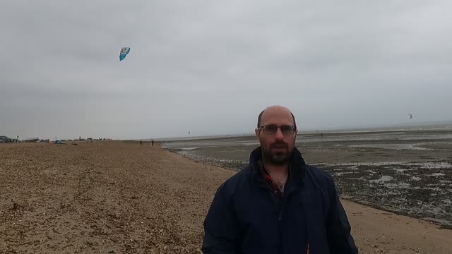 A beautiful kite. A kite surfer behind me .