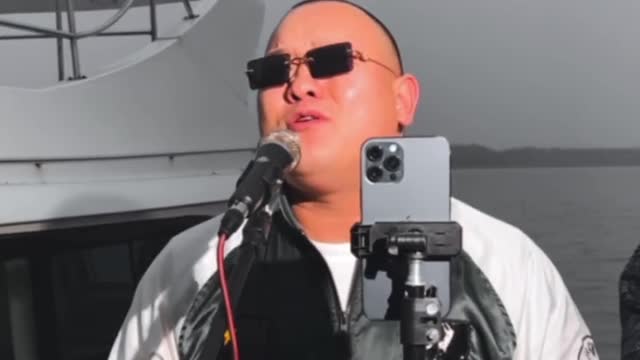 What song is the bald man singing