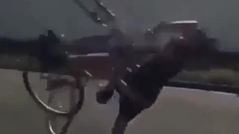 clown world- dude attempts wheely on bike with one wheel.