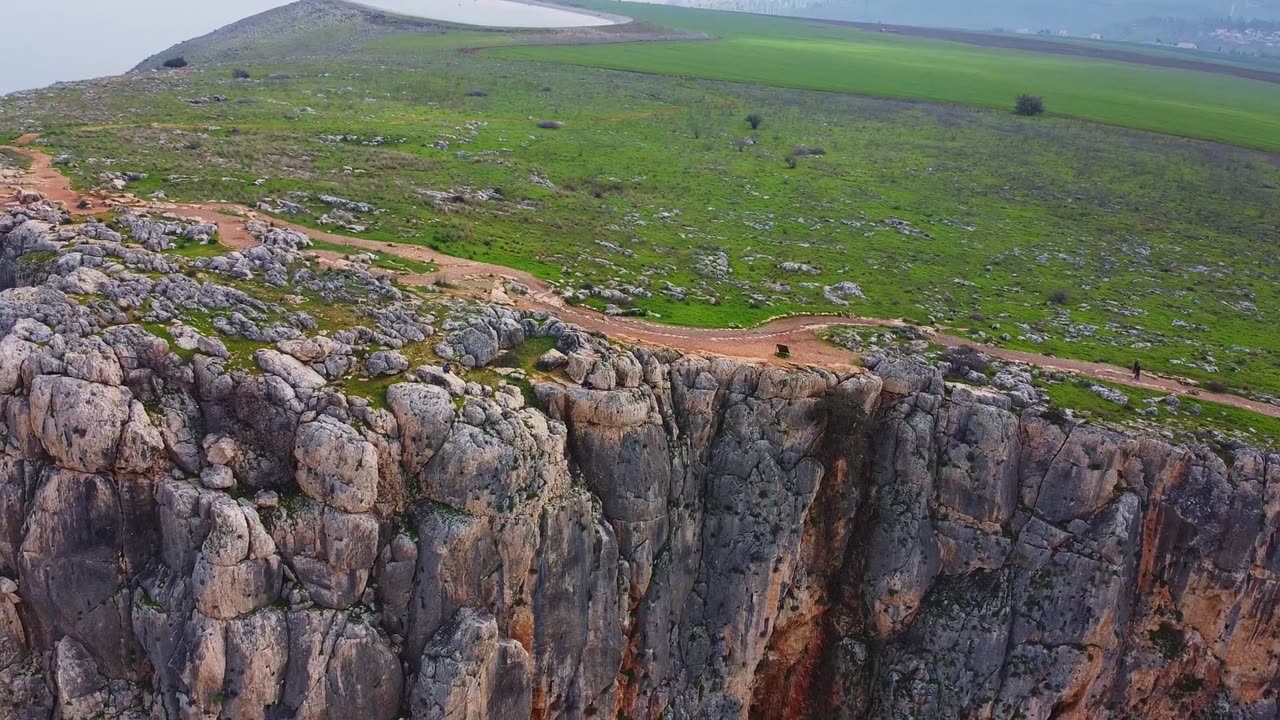 DRONE FOOTAGE OF A PLATEAU ON THE TOP OF A MONTAIN ROCK