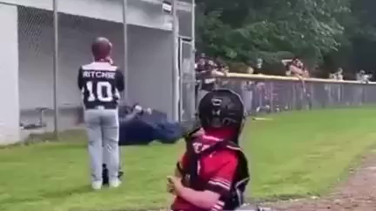 kid knocks his coach out with bat warming up