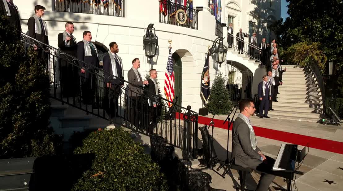 "Gay Men's Chorus" of Washington, DC sings a song at ceremony about same sex marriage held at WH South Lawn: "How justice was denied, make them hear you..."