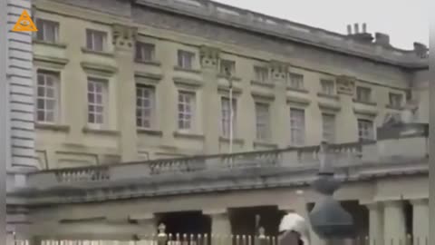 A Naked Child escaping the Buckingham Palace through a window.