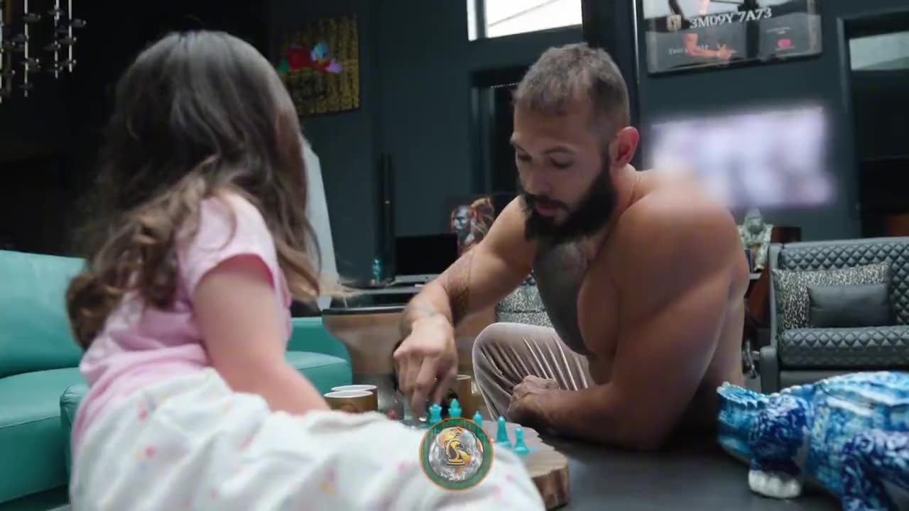 Andrew Tate showing his daughter how to play chess