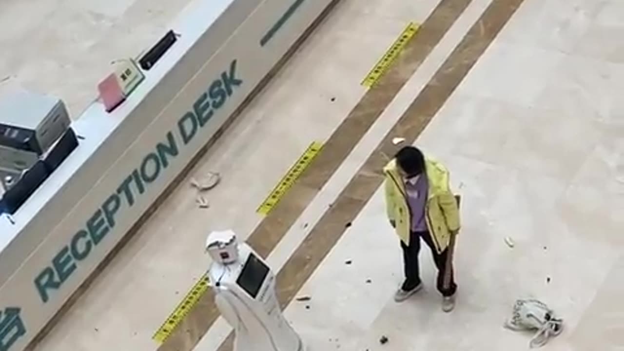 Chinese woman smashes up a robot in the hospital.