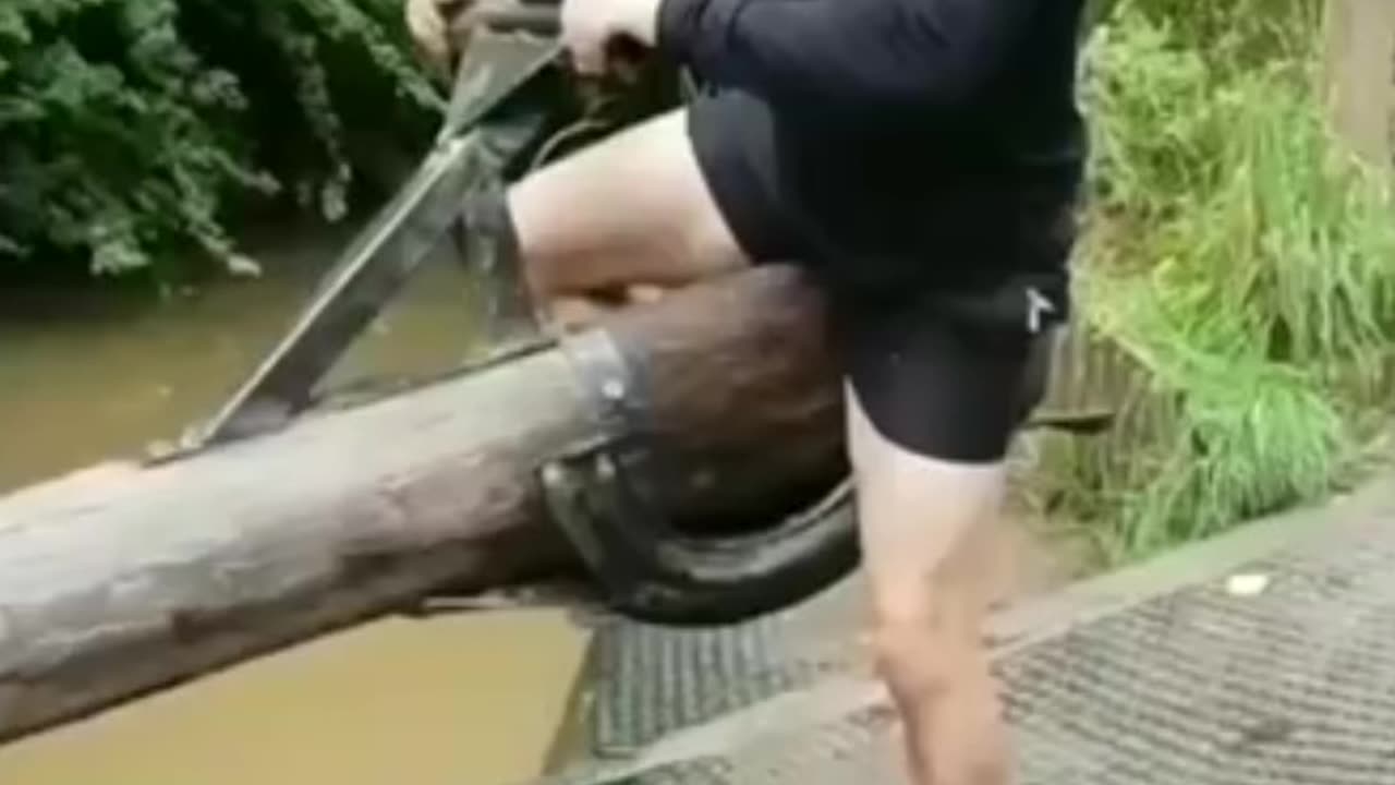 Man dunks his wife into a dirty stream