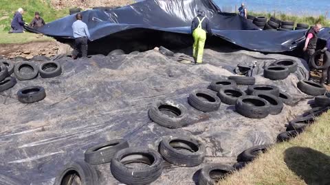 I helped cover a 5,000-year-old monument with worn-out tires