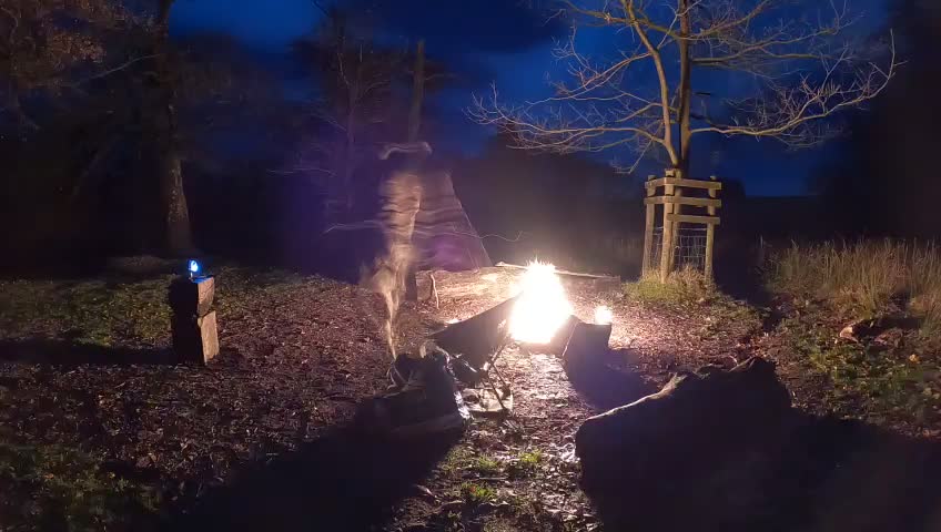 Night lapse of a vlog by campfire. Wildcamping