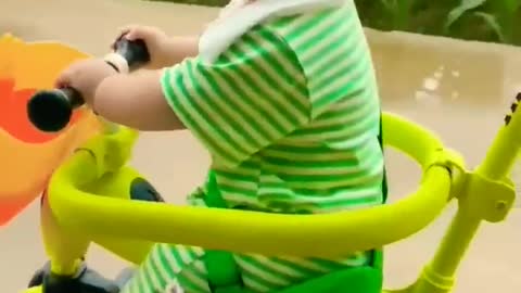 Cute baby enjoy with cycle