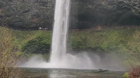 Close Up Of Water Cascading Off The Edge Of A Small Waterfall