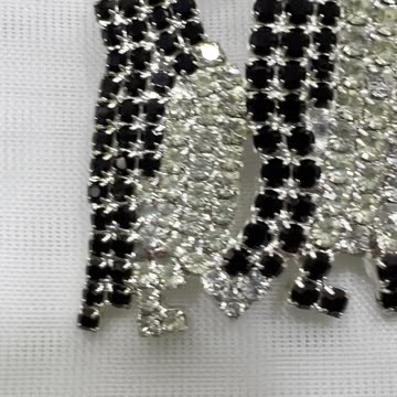 Rhodium Plated 2” x 1.25” Penguins Brooch. Made with Swarovski Crystal