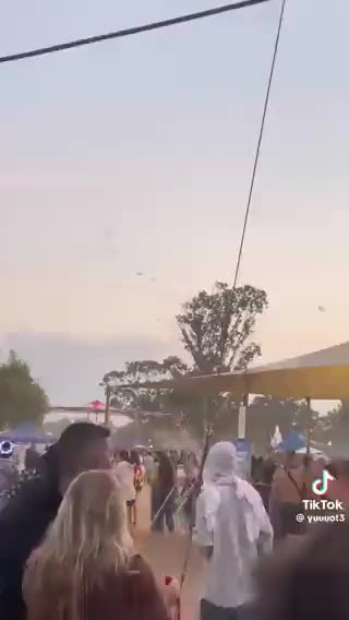 Hamas paragliding into Israel during a festival.