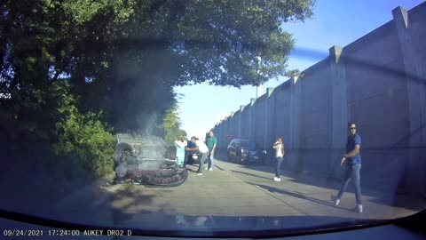 Upside-Down Car Slides Down Roadway