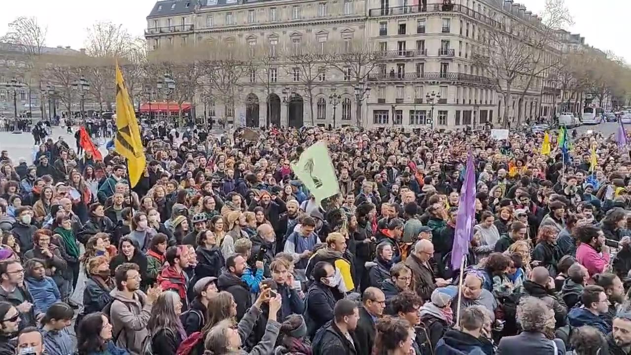 Thousands of people protest in front of the town hall in Paris against police