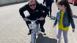 Crazy dad on small bike