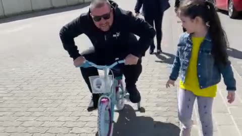 Crazy dad on small bike