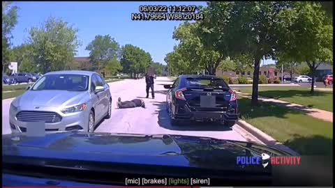 Chicago suburbs...Car randomly pulls up next to a cop, driver jumps out with an axe