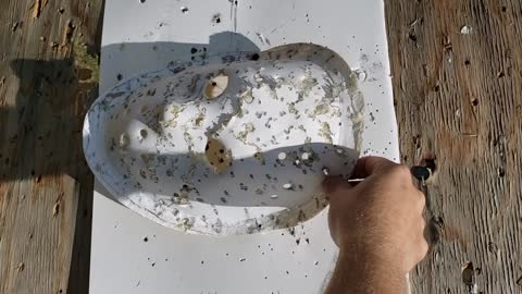 I demonstrate how to make accurate-looking bullet holes in a fiberglass mask.