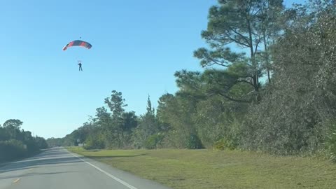 Skydiver Lands on Road