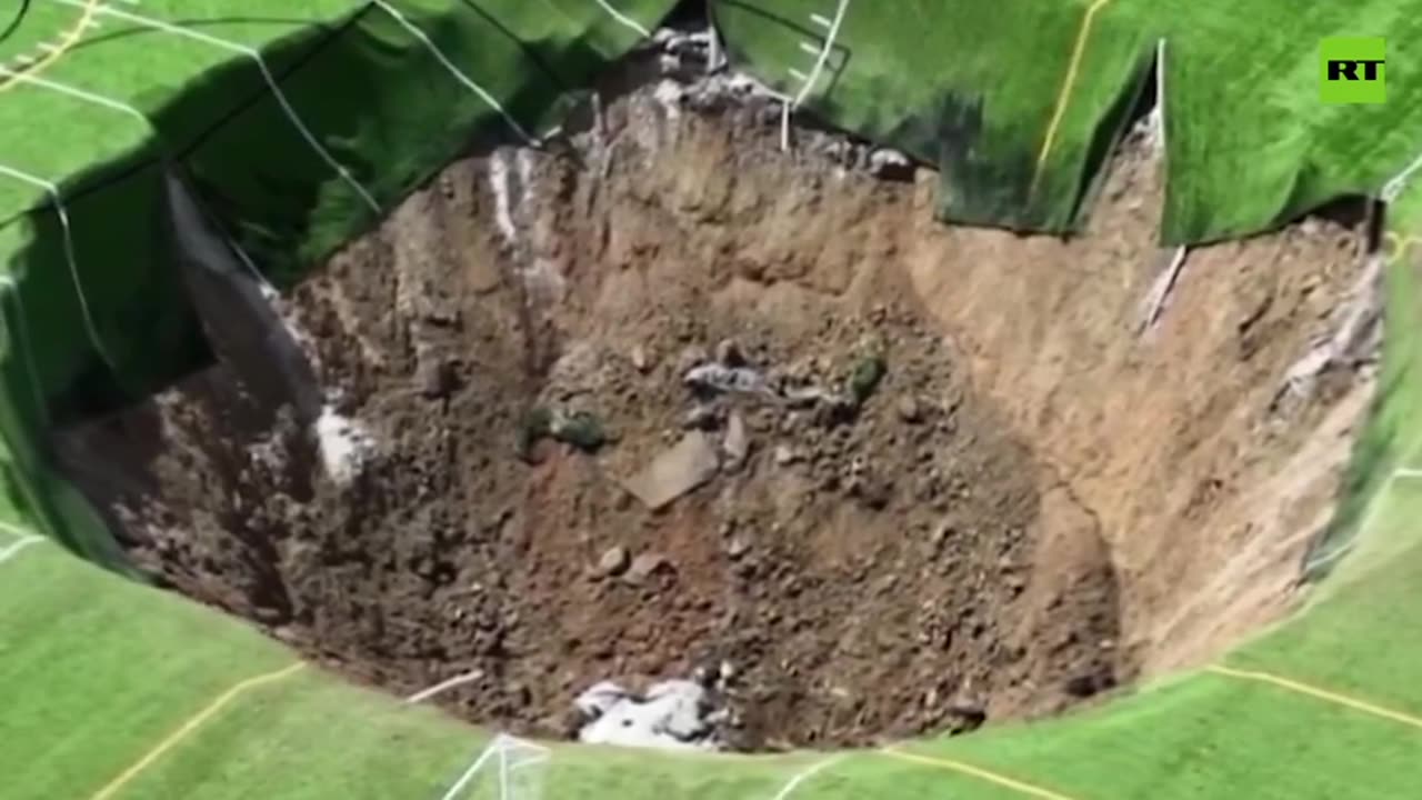 Moment massive sinkhole swallows soccer field in Alton, Illinois