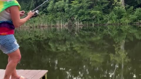Woman Catches Catfish After It Takes Off With Her Fishing Pole