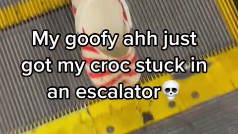 My goofy ahh just got my croc stuck in an escalator
