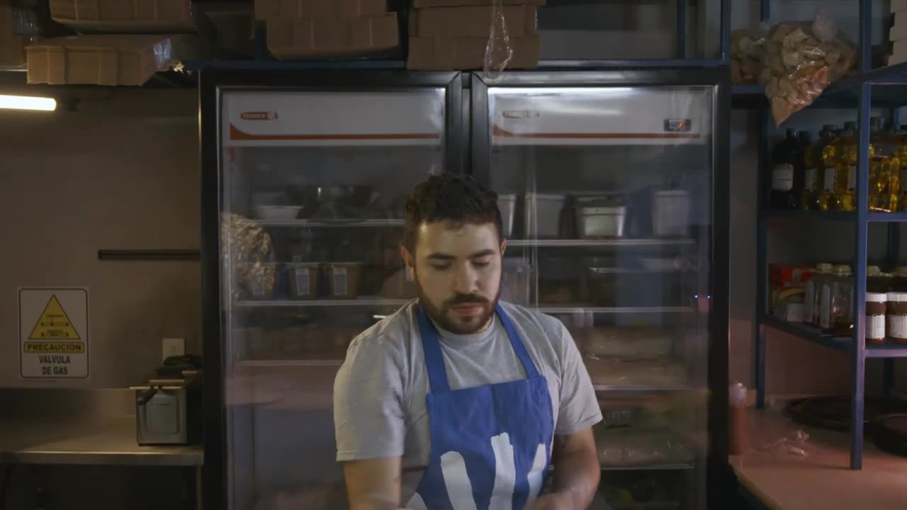 Chef doing acrobatics with the dough of a pizza