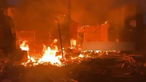 A fire near the Mayak market in Donetsk after being hit by Ukrainian MLRS.