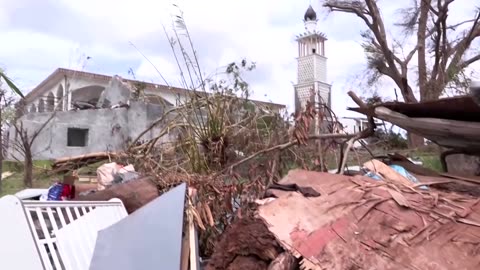 Angry residents of cyclone-hit Mayotte plead to Macron for water