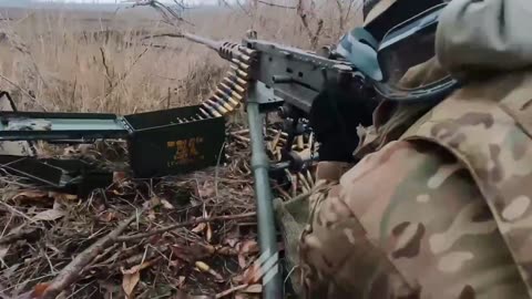 Ukrainians Firing At Russian Positions Across a Field