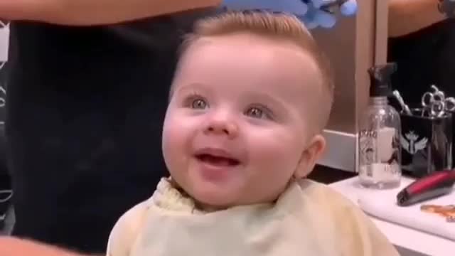 Wonderful movements of a beautiful child while styling his hair