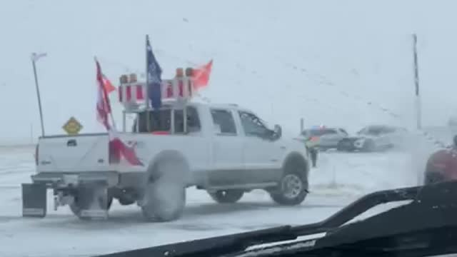 Farmers and protestors pushing past police barricade in Coutts, Alberta border