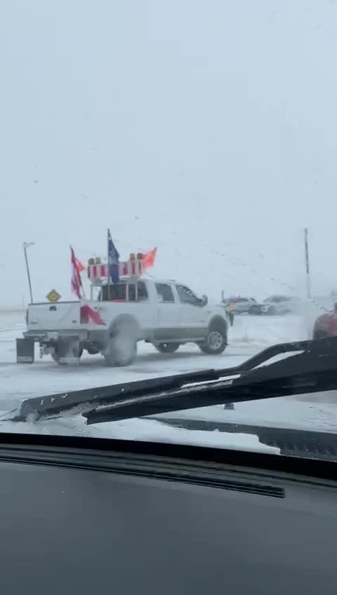 Farmers and protestors pushing past police barricade in Coutts, Alberta border