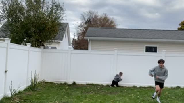 Cousin Dodges Tackle Causing Boy to Run Head First into Fence