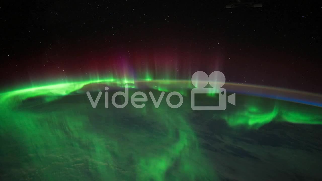 The International Space Station Flies Over The Earth With Aurora Borealis Visible 1