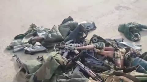 Piles of Uniforms and Rifles Litter Former Damascus Army Base