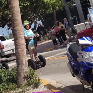 Weekend u old people ride segways down sidewalk