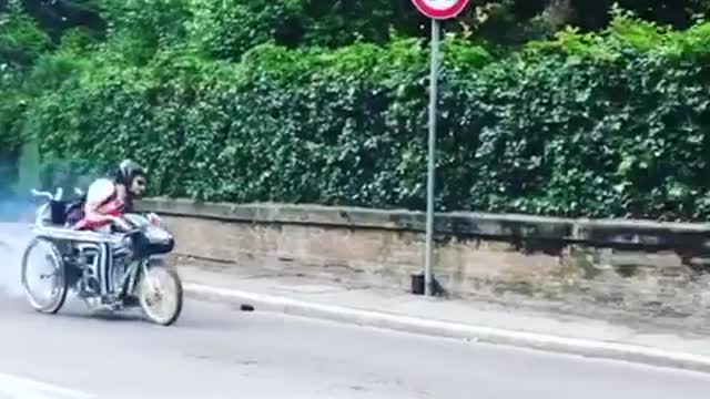 Small motorcycle misses turn and runs into fence gate