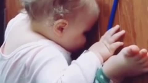 Exhausted-baby falls asleep in adorably funny position
