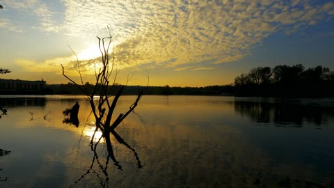 View of a Lake under a Sunset Sky