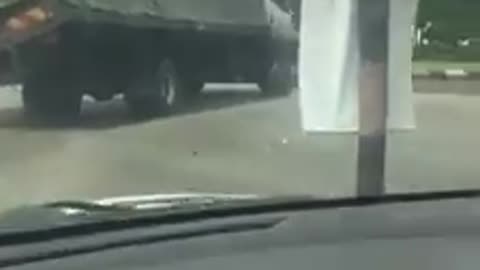 overturned truck in traffic light