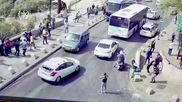 Palestinians stone Israeli car, which hits one of them