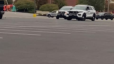 Truck Drives Circles Around Police in Parking Lot