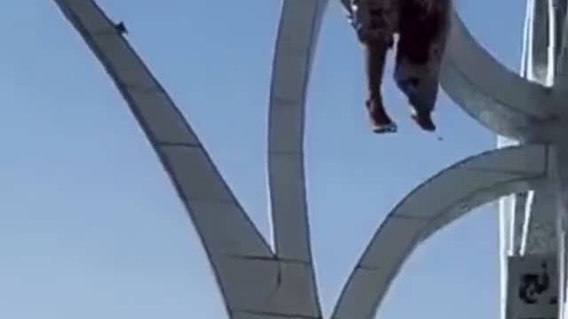 Taliban hangs dead man from a crane in the city of Herat