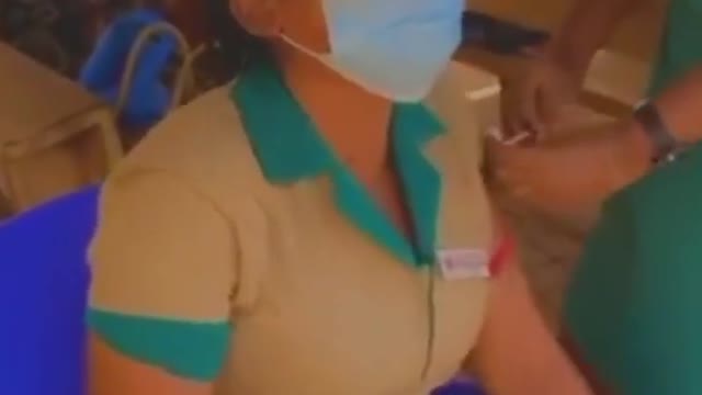 Nurse cries as she gets injected